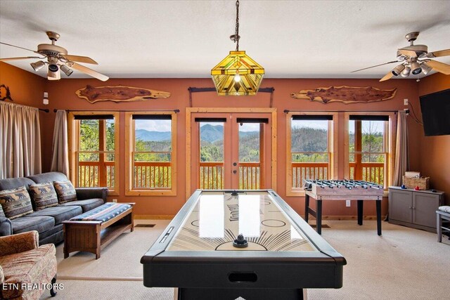 playroom featuring ceiling fan, carpet floors, french doors, and visible vents