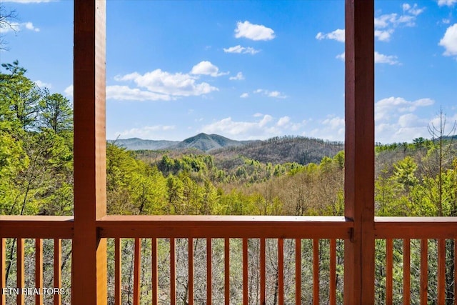 view of mountain feature with a wooded view