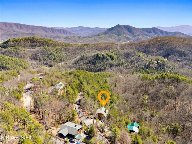 mountain view featuring a view of trees