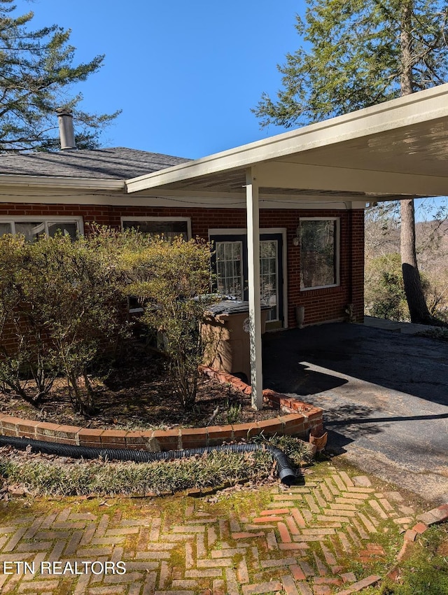 property entrance with brick siding