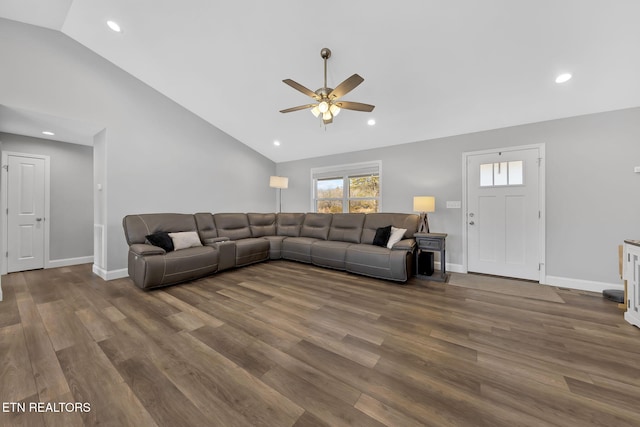 living room with baseboards, wood finished floors, and recessed lighting