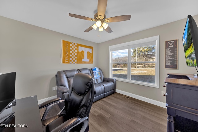 office with dark wood-style flooring, visible vents, ceiling fan, and baseboards