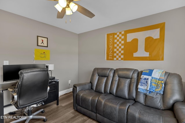 office area with wood finished floors, a ceiling fan, and baseboards