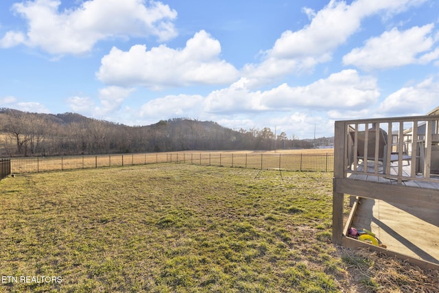 view of yard featuring fence and a rural view