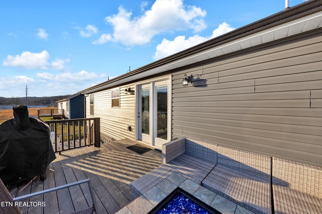 wooden deck with grilling area