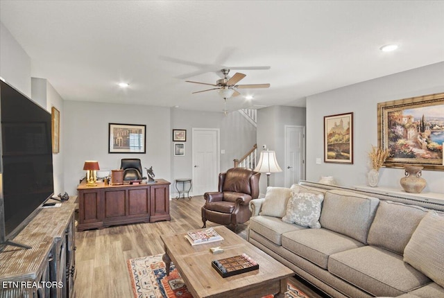 living area with light wood finished floors, a ceiling fan, and recessed lighting