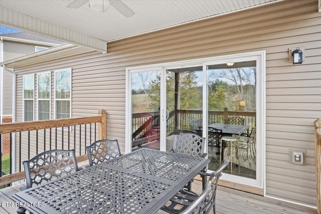 sunroom featuring a healthy amount of sunlight and ceiling fan