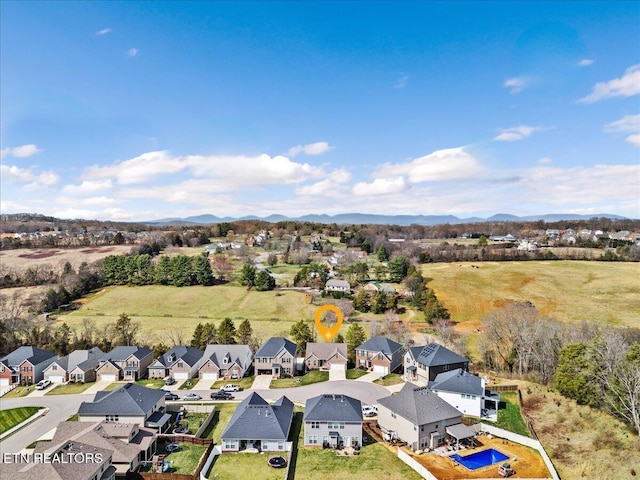 aerial view featuring a mountain view and a residential view