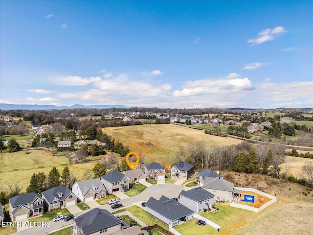 birds eye view of property with a residential view