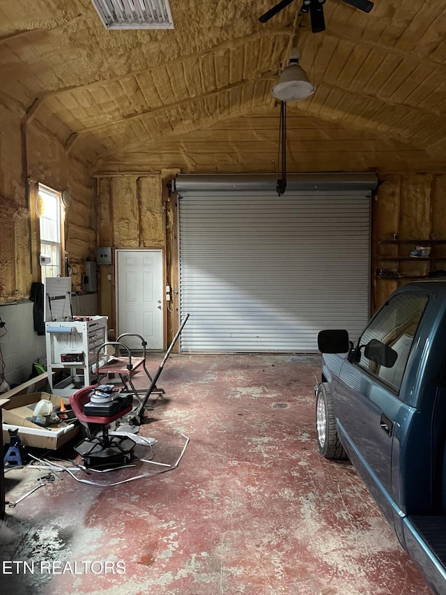 garage with visible vents and a ceiling fan