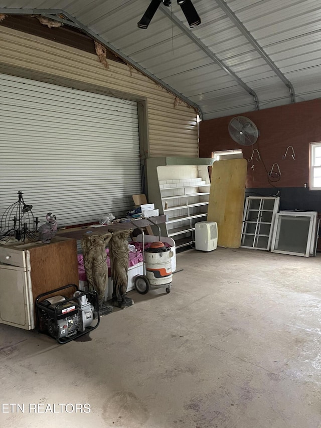 garage with ceiling fan and metal wall