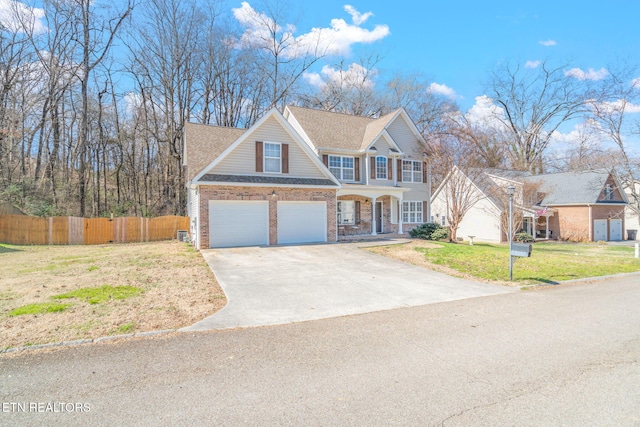 view of front of house featuring a garage, brick siding, fence, concrete driveway, and a front lawn