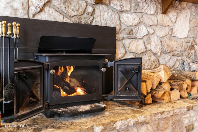 room details with a warm lit fireplace