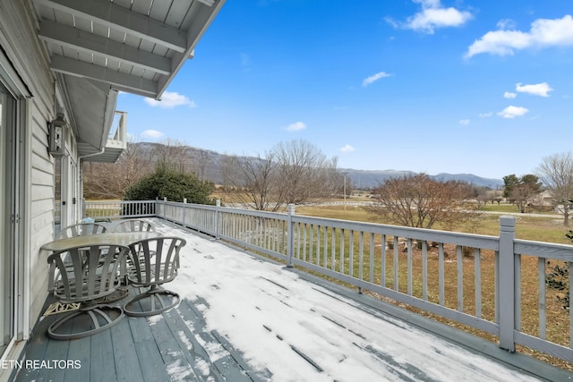 wooden deck featuring a mountain view