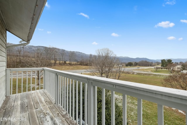 balcony featuring a rural view and a mountain view