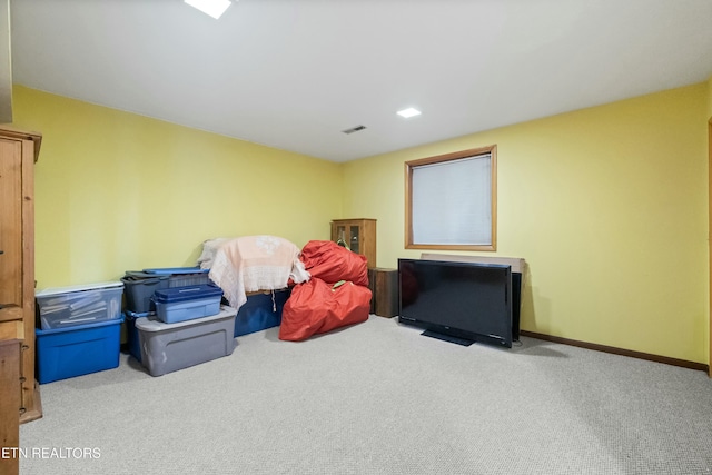 interior space with carpet floors, visible vents, and baseboards