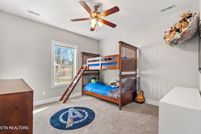 bedroom with carpet, visible vents, and baseboards