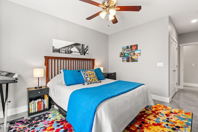 bedroom featuring baseboards and a ceiling fan