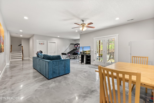 living area with baseboards, visible vents, stairway, finished concrete floors, and recessed lighting