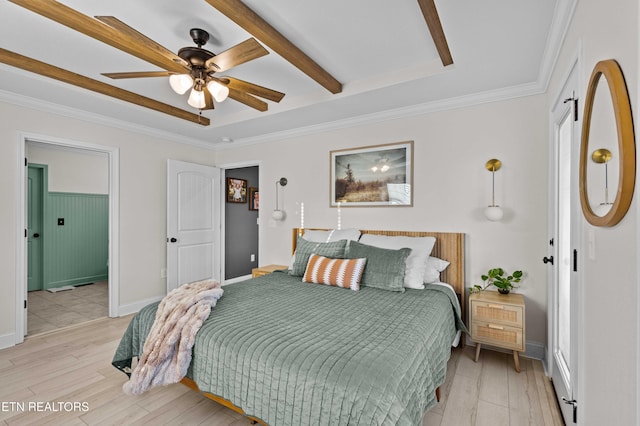 bedroom featuring baseboards, ceiling fan, ornamental molding, and light wood-style floors