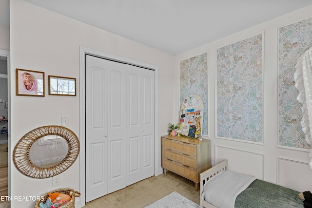 carpeted bedroom featuring a closet