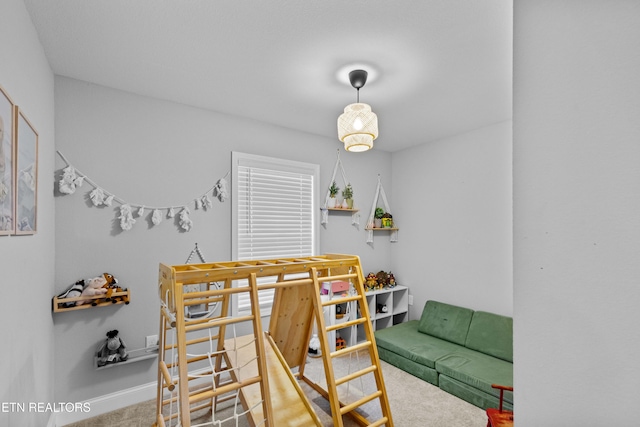 bedroom with carpet floors and baseboards