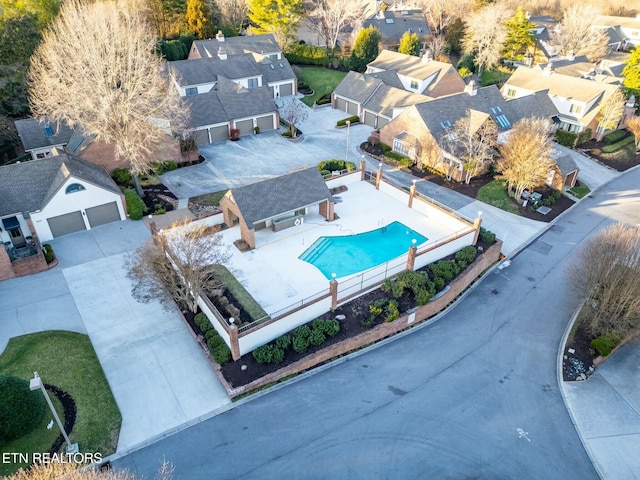 birds eye view of property with a residential view