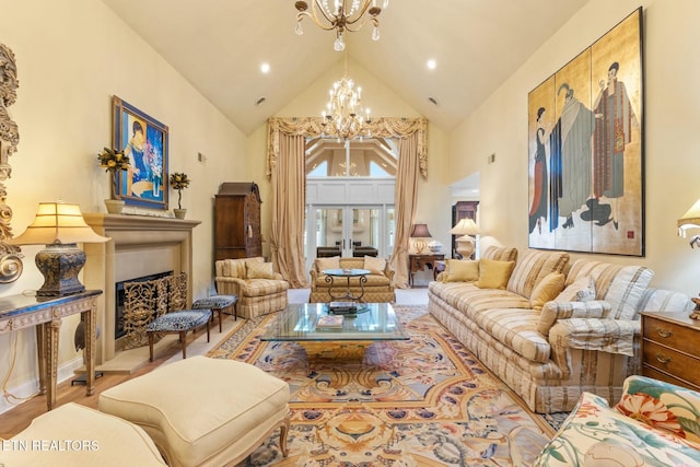 living room with high vaulted ceiling, a fireplace with raised hearth, recessed lighting, french doors, and a notable chandelier