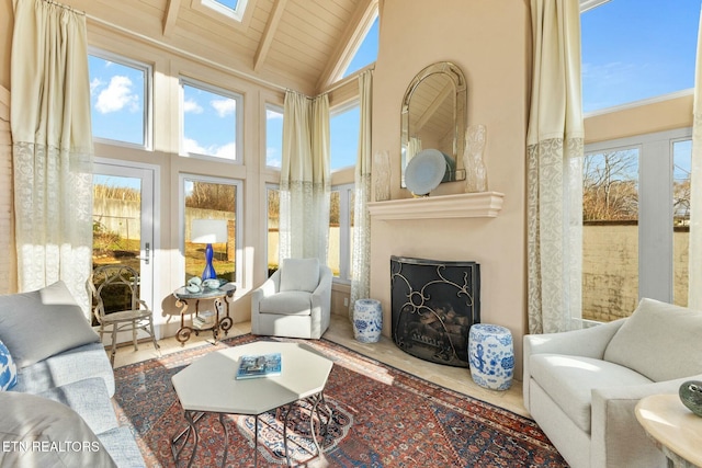 living room featuring beam ceiling, high vaulted ceiling, wood ceiling, and a fireplace