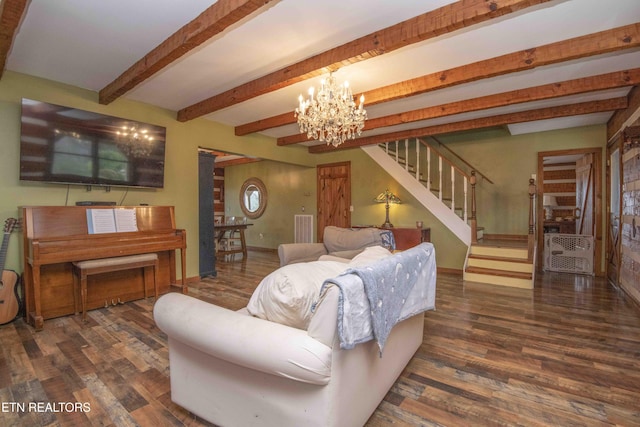 living room with wood finished floors, a notable chandelier, beam ceiling, and stairs