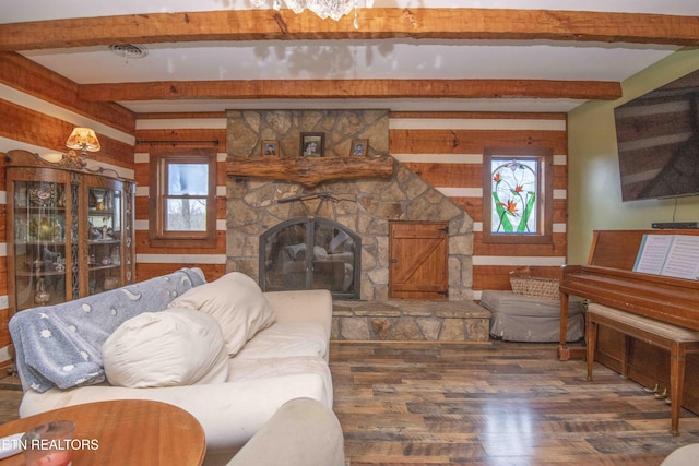 living area with wood walls, a fireplace, wood finished floors, and beam ceiling