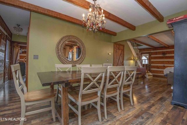 dining room featuring visible vents, wood finished floors, beam ceiling, and an inviting chandelier