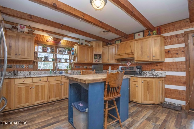 kitchen with dark wood-style flooring, custom exhaust hood, open shelves, a sink, and wood counters