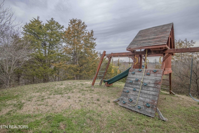 view of jungle gym with a lawn