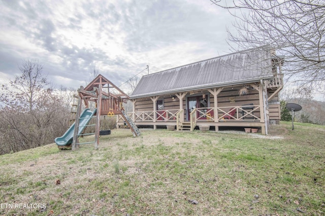 exterior space with a porch and a lawn