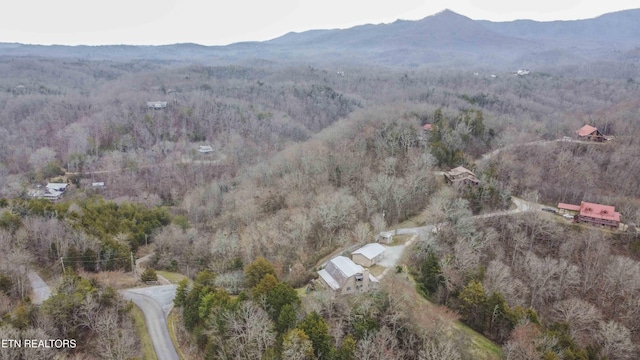 aerial view featuring a mountain view and a forest view