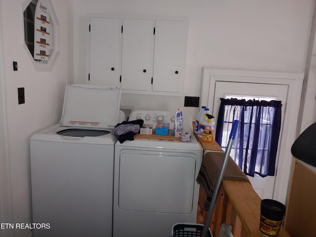 laundry area with cabinet space and washing machine and clothes dryer