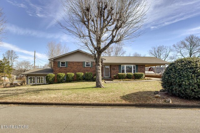 610 Hudson St, Athens, TN 37303 - view of front of property featuring brick siding, a front yard, and an attached carport