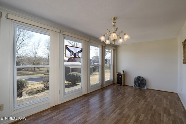 610 Hudson St, Athens, TN 37303 - unfurnished dining area with a chandelier, wood finished floors, and baseboards