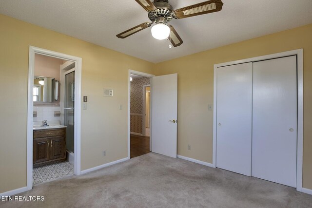 610 Hudson St, Athens, TN 37303 - unfurnished bedroom with a sink, baseboards, a closet, carpet, and ensuite bath