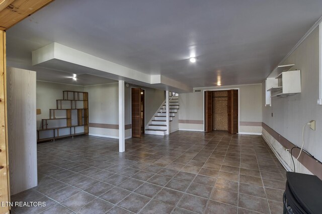 610 Hudson St, Athens, TN 37303 - finished basement with dark tile patterned flooring, stairway, and baseboards
