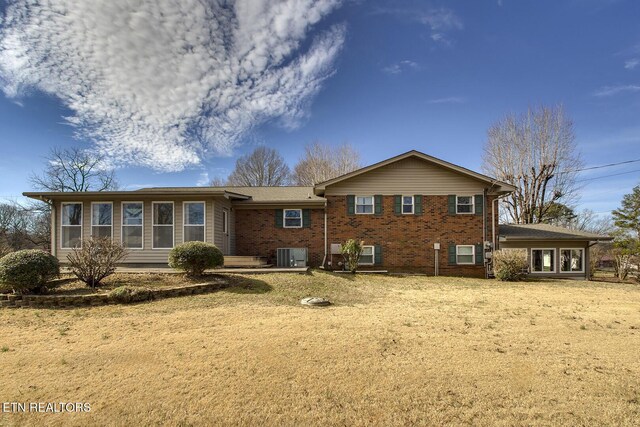 610 Hudson St, Athens, TN 37303 - back of house with central air condition unit and brick siding