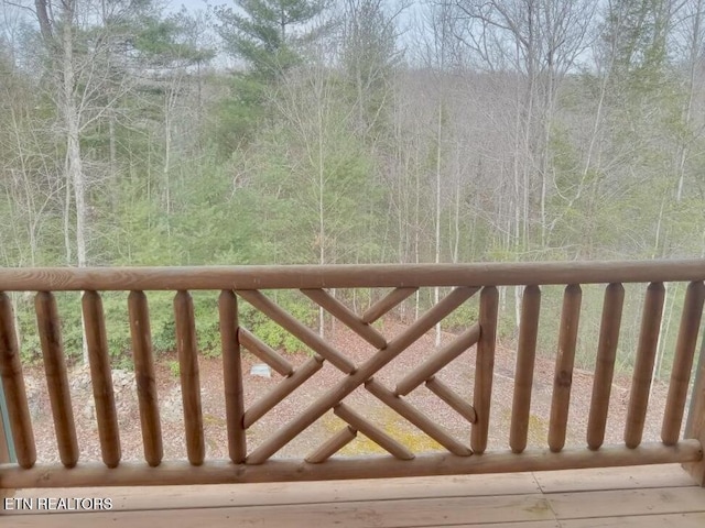 deck featuring a forest view