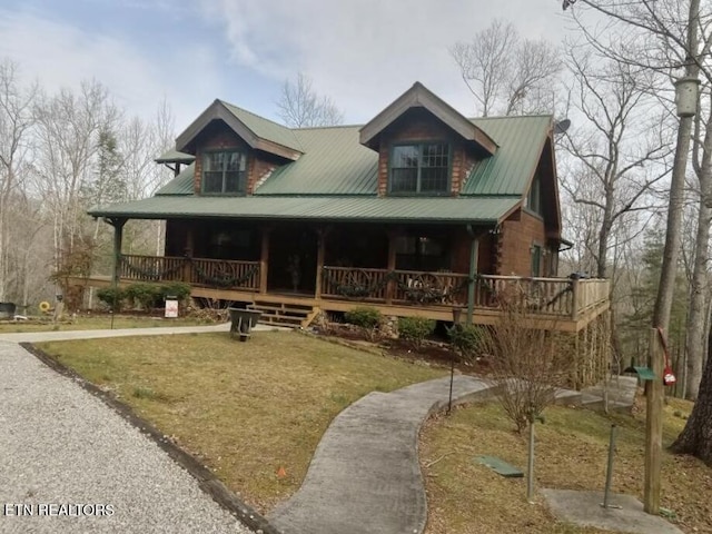 view of front of property with metal roof and a porch