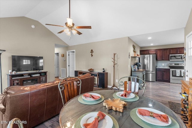 dining room with recessed lighting, visible vents, a ceiling fan, wood finished floors, and high vaulted ceiling