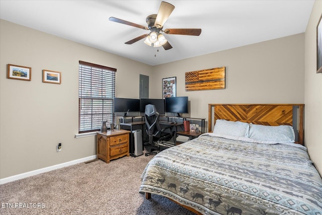 bedroom featuring light carpet, baseboards, and a ceiling fan