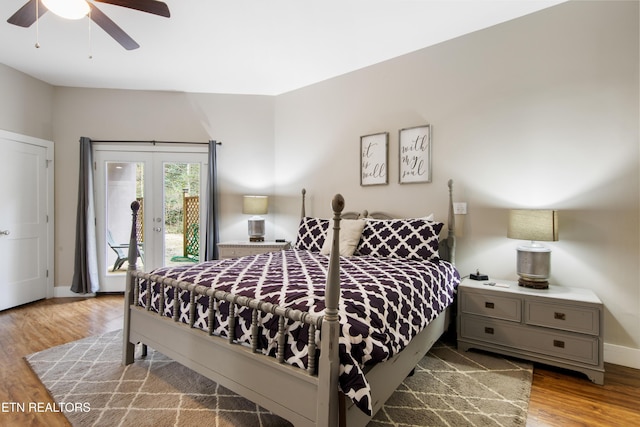 bedroom featuring wood finished floors, a ceiling fan, baseboards, access to exterior, and french doors