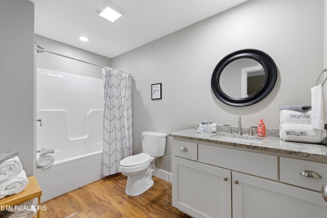 full bath featuring shower / bath combination with curtain, vanity, toilet, and wood finished floors