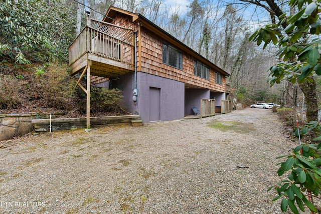 rear view of house with driveway