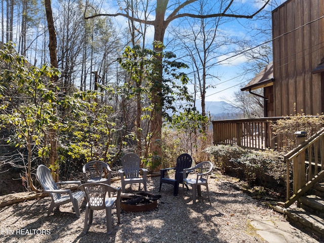 view of yard with a patio and an outdoor fire pit